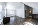 Open-concept living room with gray walls and floors and lots of natural light at 5479 Dorsett Shoals Rd, Douglasville, GA 30135