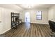 Living room with gray walls, light fixture, and a workstation area with a desk at 5479 Dorsett Shoals Rd, Douglasville, GA 30135