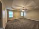 Large main bedroom with carpet and ceiling fan at 567 Hansen Dr, Locust Grove, GA 30248