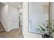 Bright hallway with wood-look flooring leading to a glimpse of the kitchen at 11521 Kimberly Way # 5, Hampton, GA 30228