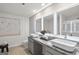 Modern bathroom with double sinks, granite countertops, and backlit mirrors, providing a stylish and functional space at 11517 Kimberly Way # 3, Hampton, GA 30228