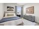Stylish bedroom with a neutral palette, featuring a comfortable bed, modern dresser, and a serene ambiance at 11517 Kimberly Way # 3, Hampton, GA 30228