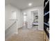 Bright hallway featuring neutral carpet and access to bedrooms, offering a welcoming transition between spaces at 11517 Kimberly Way # 3, Hampton, GA 30228