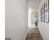 Bright hallway with wood floors, modern artwork, and a view of the home's stylish interior at 11517 Kimberly Way # 3, Hampton, GA 30228