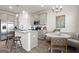 Bright eat-in kitchen features stainless appliances, granite countertops, and breakfast bar at 11517 Kimberly Way # 3, Hampton, GA 30228