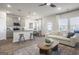 Stylish living area with an eat-in kitchen island, modern furnishings, and hardwood floors at 11517 Kimberly Way # 3, Hampton, GA 30228