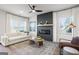 Cozy living room with a modern fireplace, ceiling fan, and stylish decor at 11517 Kimberly Way # 3, Hampton, GA 30228