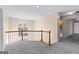 Upstairs hallway with carpet and large window at 194 Cobblestone Cv, Sharpsburg, GA 30277