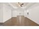 Bright living room featuring hardwood floors, a tray ceiling with a ceiling fan and abundant natural light at 1705 Goodwin Dr # 28, Hampton, GA 30228