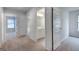 Upstairs hallway and a view into a bathroom at 1709 Goodwin Dr # 29, Hampton, GA 30228