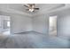 Spacious main bedroom with tray ceiling, ceiling fan, and plush carpet at 1709 Goodwin Dr # 29, Hampton, GA 30228