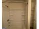 Bathroom with shower/tub combo and shelving at 306 Blackfoot Trl, Villa Rica, GA 30180