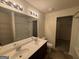 Bathroom with double vanity, tub, and shower at 306 Blackfoot Trl, Villa Rica, GA 30180