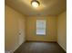 Simple bedroom with carpeted flooring and a window at 306 Blackfoot Trl, Villa Rica, GA 30180