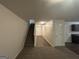 Bright hallway with stairs leading to the upper level at 306 Blackfoot Trl, Villa Rica, GA 30180