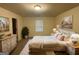 Main bedroom with a dresser, a queen-size bed, and neutral decor at 306 Blackfoot Trl, Villa Rica, GA 30180