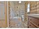 Stylish bathroom features wood and tile accents, a modern vanity, and a unique soaking tub at 435 Crabapple Rd, Fayetteville, GA 30215