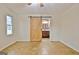 Spacious bedroom featuring parquet floors, a ceiling fan, and a wood-look sliding barn door at 435 Crabapple Rd, Fayetteville, GA 30215