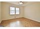 Bright bedroom with parquet floors and a large window providing an ample amount of natural light at 435 Crabapple Rd, Fayetteville, GA 30215