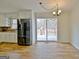 Kitchen with stainless steel appliances and sliding glass doors to deck at 435 Crabapple Rd, Fayetteville, GA 30215