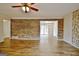 Bright living room showcasing a wood accent wall and hardwood floors at 435 Crabapple Rd, Fayetteville, GA 30215