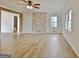 Living room showcasing natural stone and wood accents with hardwood floors at 435 Crabapple Rd, Fayetteville, GA 30215