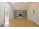 Inviting living room with stone fireplace, vaulted ceilings, and access to an outdoor porch at 435 Crabapple Rd, Fayetteville, GA 30215