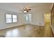 Open-concept living room with hardwood floors and lots of natural light at 435 Crabapple Rd, Fayetteville, GA 30215