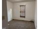 Modest bedroom featuring neutral walls, carpet, and a window at 7472 Woods Ct, Lithonia, GA 30058