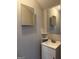 Bathroom featuring vanity sink, mirror, and neutral-colored walls at 251 Ralph David Abernathy Sw Blvd, Atlanta, GA 30312