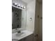 Bathroom features a vanity sink and shower-tub combo with white trim and fixtures at 251 Ralph David Abernathy Sw Blvd, Atlanta, GA 30312