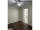 A clean bedroom featuring wood floors with a bathroom visible through an open door at 251 Ralph David Abernathy Sw Blvd, Atlanta, GA 30312