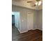 Bedroom featuring neutral walls, laminate flooring, ceiling fan, and closet space at 251 Ralph David Abernathy Sw Blvd, Atlanta, GA 30312