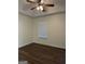 Bedroom with hardwood floor, window with blinds, and neutral colored walls at 251 Ralph David Abernathy Sw Blvd, Atlanta, GA 30312