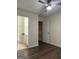 Bright bedroom features hardwood floors, ceiling fan, ensuite bathroom, and a neutral color palette at 251 Ralph David Abernathy Sw Blvd, Atlanta, GA 30312