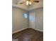 Bedroom featuring laminate floors, a ceiling fan, and a small window at 251 Ralph David Abernathy Sw Blvd, Atlanta, GA 30312
