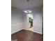 An open dining area showcasing hardwood floors and a view into the modern kitchen at 251 Ralph David Abernathy Sw Blvd, Atlanta, GA 30312