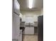 Bright kitchen with white cabinets, granite countertops, and stainless steel appliances at 251 Ralph David Abernathy Sw Blvd, Atlanta, GA 30312