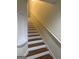 Interior view of a staircase with wooden steps, white risers, and handrail at 251 Ralph David Abernathy Sw Blvd, Atlanta, GA 30312