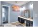 Double vanity bathroom with dark cabinets and a window at 2744 Amber Springs Way, Buford, GA 30519