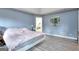 Main bedroom with a large bed and a view of the backyard at 2744 Amber Springs Way, Buford, GA 30519