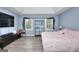 Spacious main bedroom with large bed, TV, and window at 2744 Amber Springs Way, Buford, GA 30519