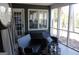 Relaxing screened porch with wicker furniture and view of backyard at 2744 Amber Springs Way, Buford, GA 30519