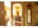 Bright dining room with hardwood floors and a view into the kitchen at 80 Tanners Ct, Covington, GA 30016