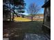 View of a spacious backyard featuring a wood fence and mature trees creating a private outdoor space at 80 Tanners Ct, Covington, GA 30016