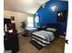Spacious bedroom with twin beds, themed accent wall, and ample natural light creating a cozy and inviting space at 80 Tanners Ct, Covington, GA 30016