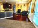 View of dining area and modern kitchen with stainless steel appliances at 80 Tanners Ct, Covington, GA 30016