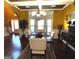 Well-lit dining room featuring a large window, stylish chandelier, and elegant furniture at 80 Tanners Ct, Covington, GA 30016