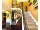 Inviting two-story foyer with hardwood floors, staircase, and decorative accents creating a warm and welcoming atmosphere at 80 Tanners Ct, Covington, GA 30016