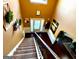View of foyer from top of staircase with high ceilings and half-wall wainscotting at 80 Tanners Ct, Covington, GA 30016